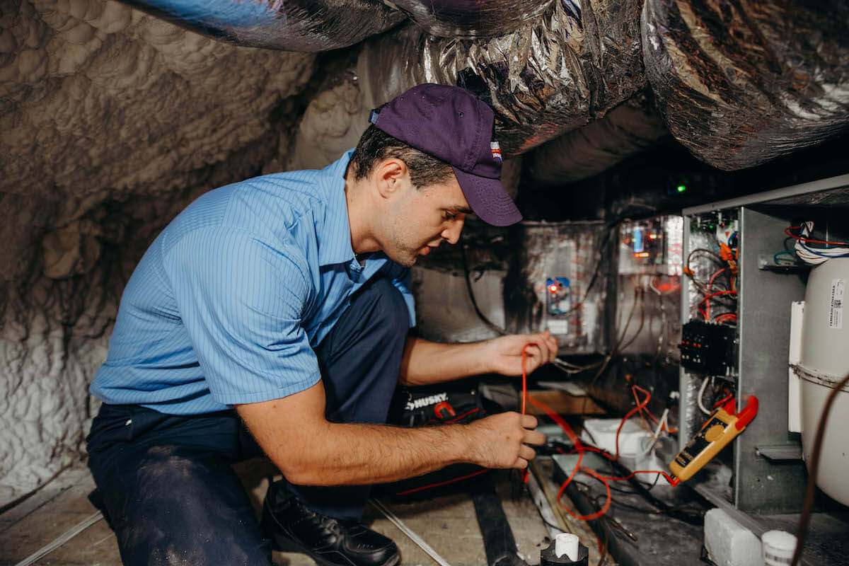 technician working on air conditioning repair