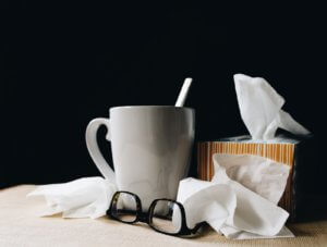 coffee mug next to tissue box