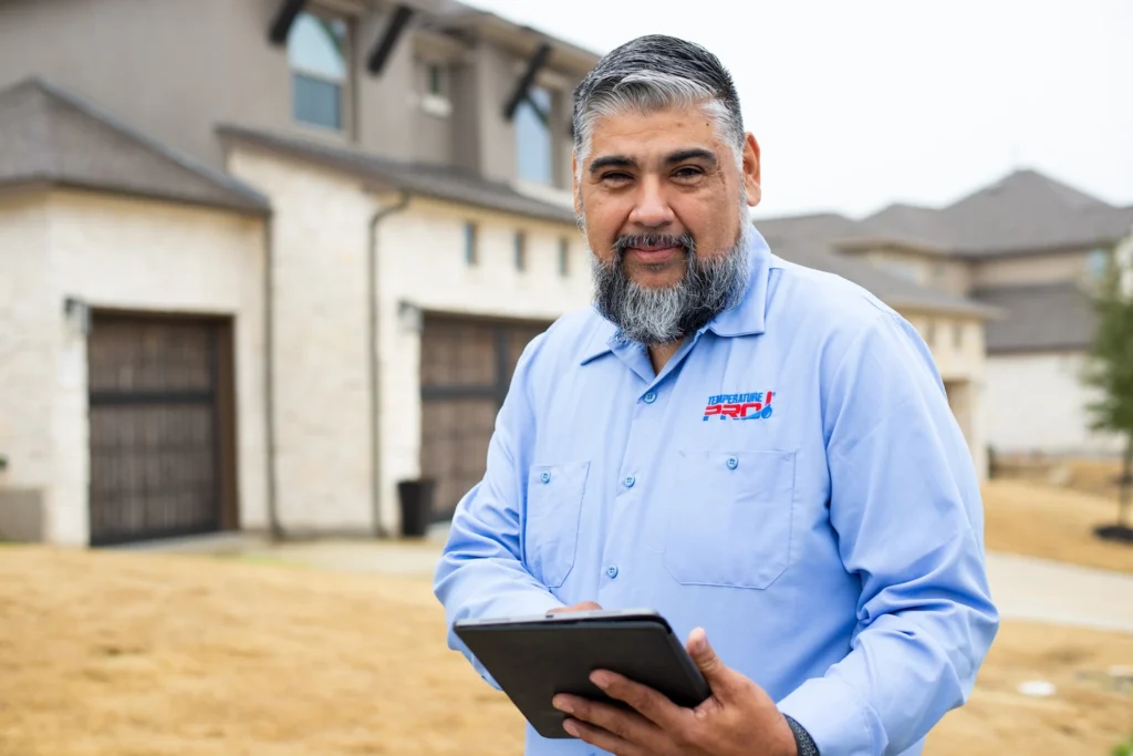 TemperaturePro Bluffton AC repair technician showing customer details on a company ipad.