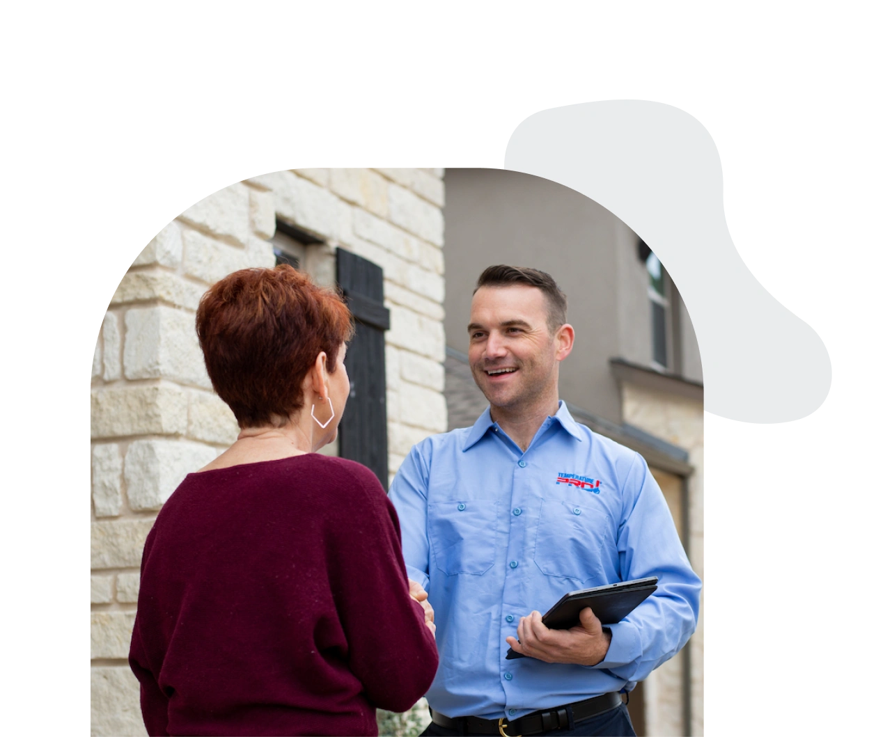 TemperaturePro Kirkland technician shaking hands with customer after repairing Heating.