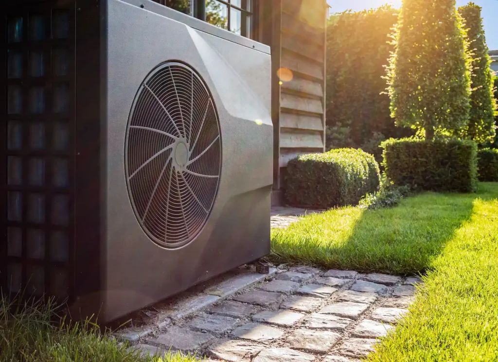 Heat pump system on concrete slab in the yard of a home in Bluffton, South Carolina.