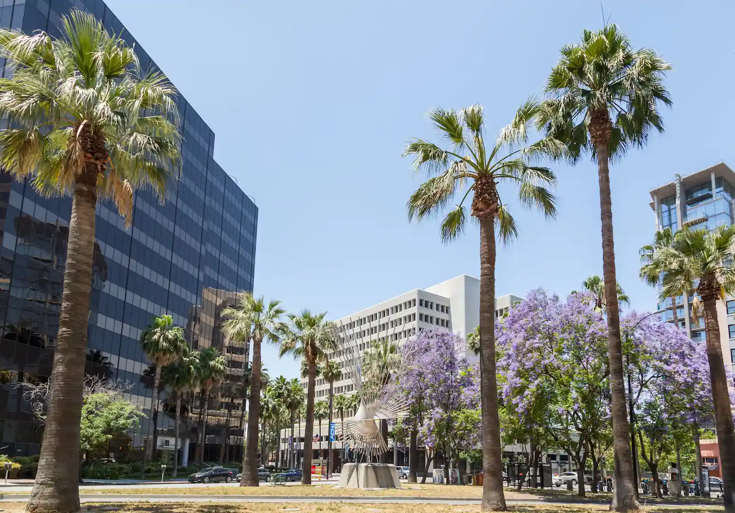 Metal sculpture surrounded by palm trees in downtown San Jose.