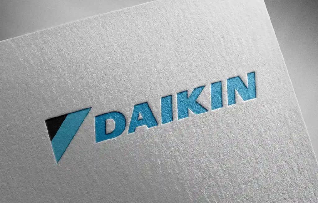 Daikin AC and heating manufacturing company logo on white paper.