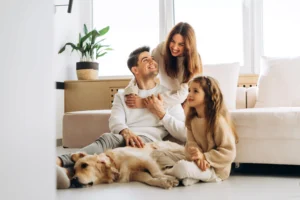 Family sitting on floor inside home in Bellevue.