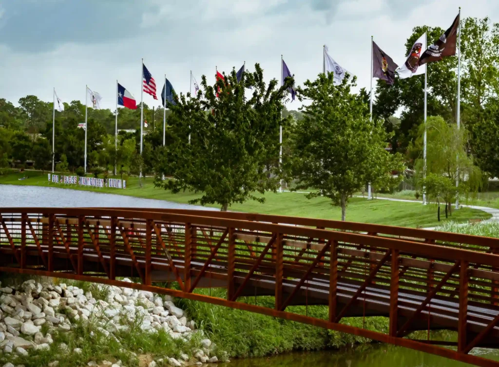 Pedestrian bridge in flag park in Conroe, Texas.