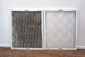 Side by side comparison of dirty HVAC air filter and clean air filter.