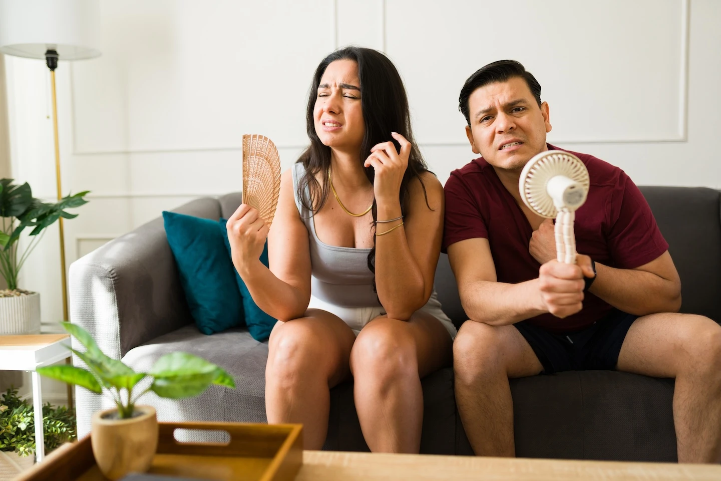 Couple struggling to stay cool in a heatwave. 