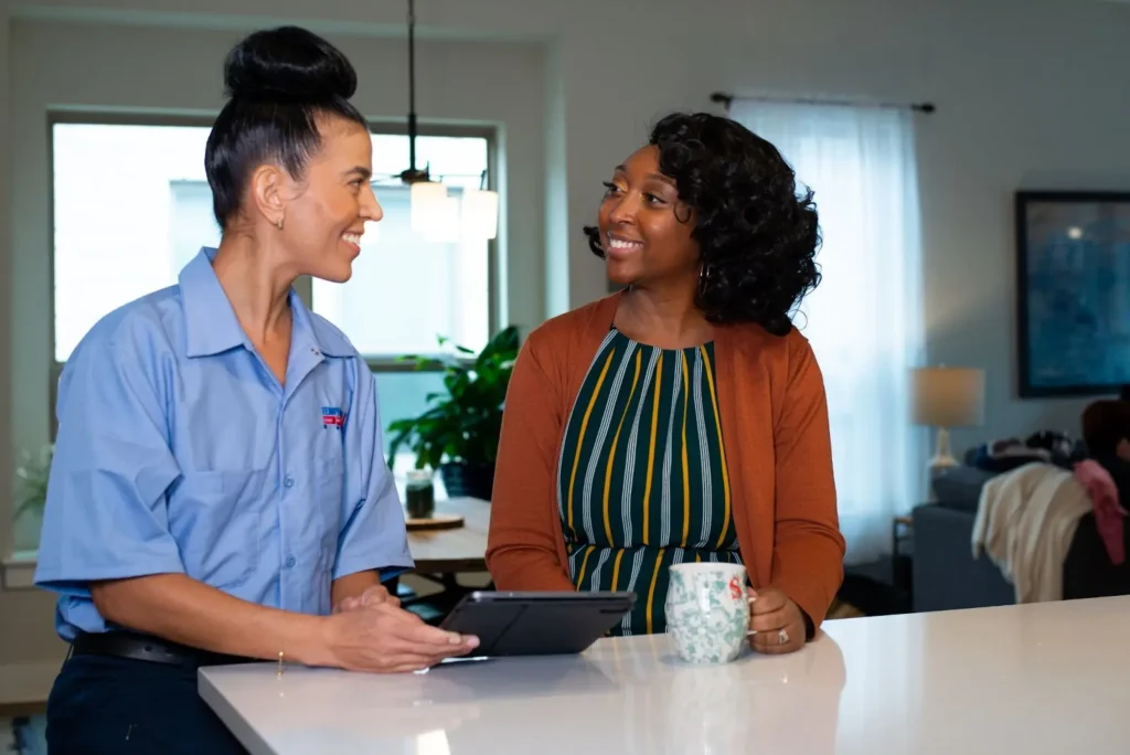 TemperaturePro Brighton employee walking customer through air purification options.