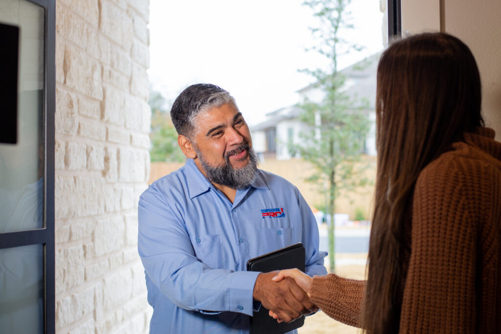 Silicon Valley HVAC tech shakes hands with the homeowner.